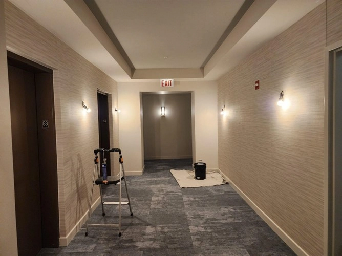The Grant Luxury Condos hallway wallcovering installation